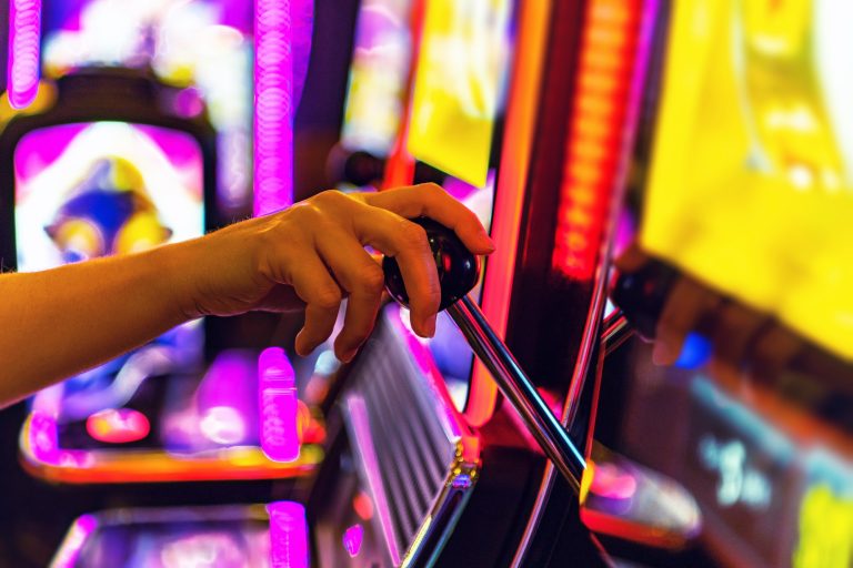 woman-playing-one-handed-casino-slot-game